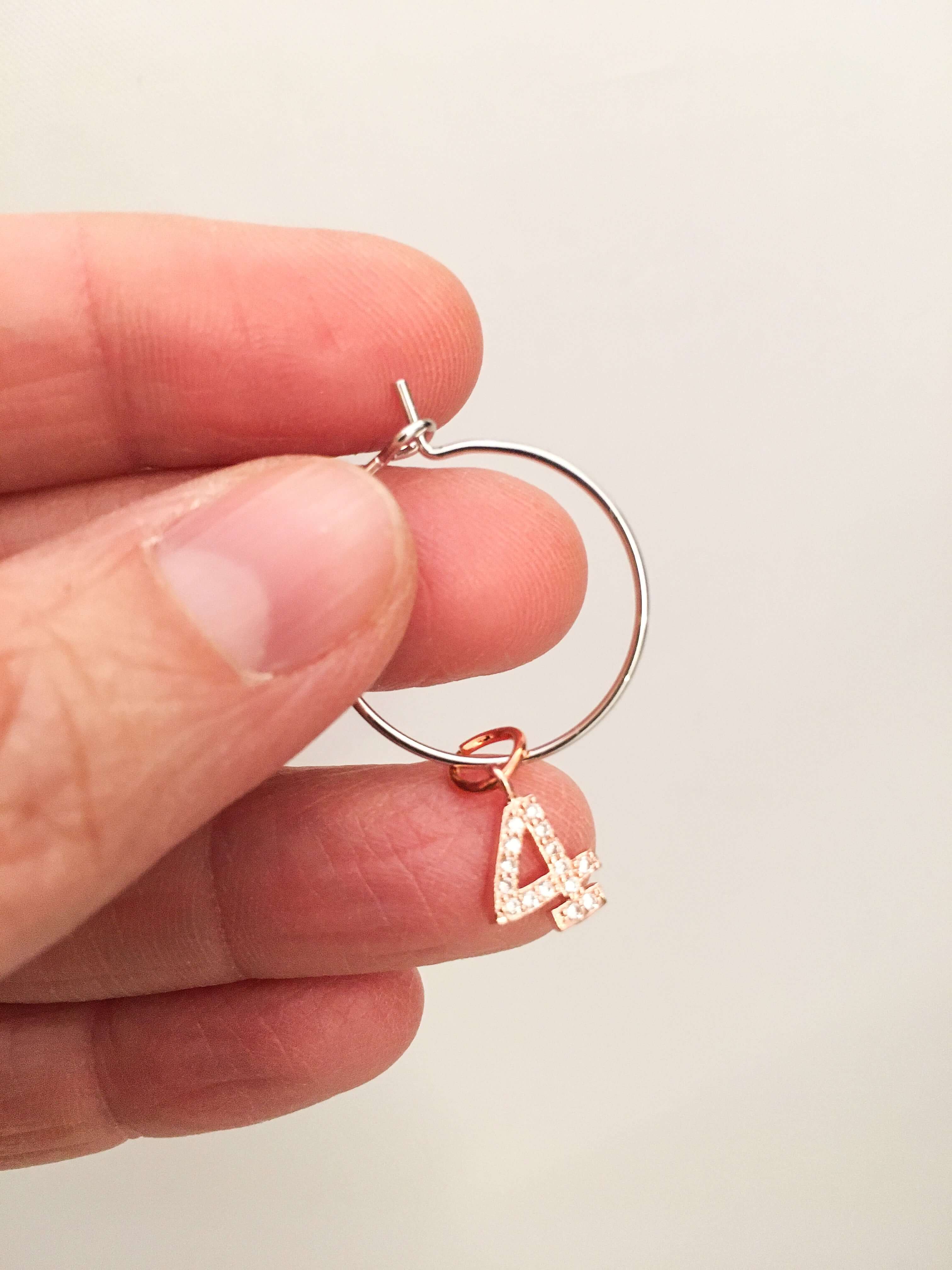 Number hoop earrings in silver, rose gold and rhinestones.